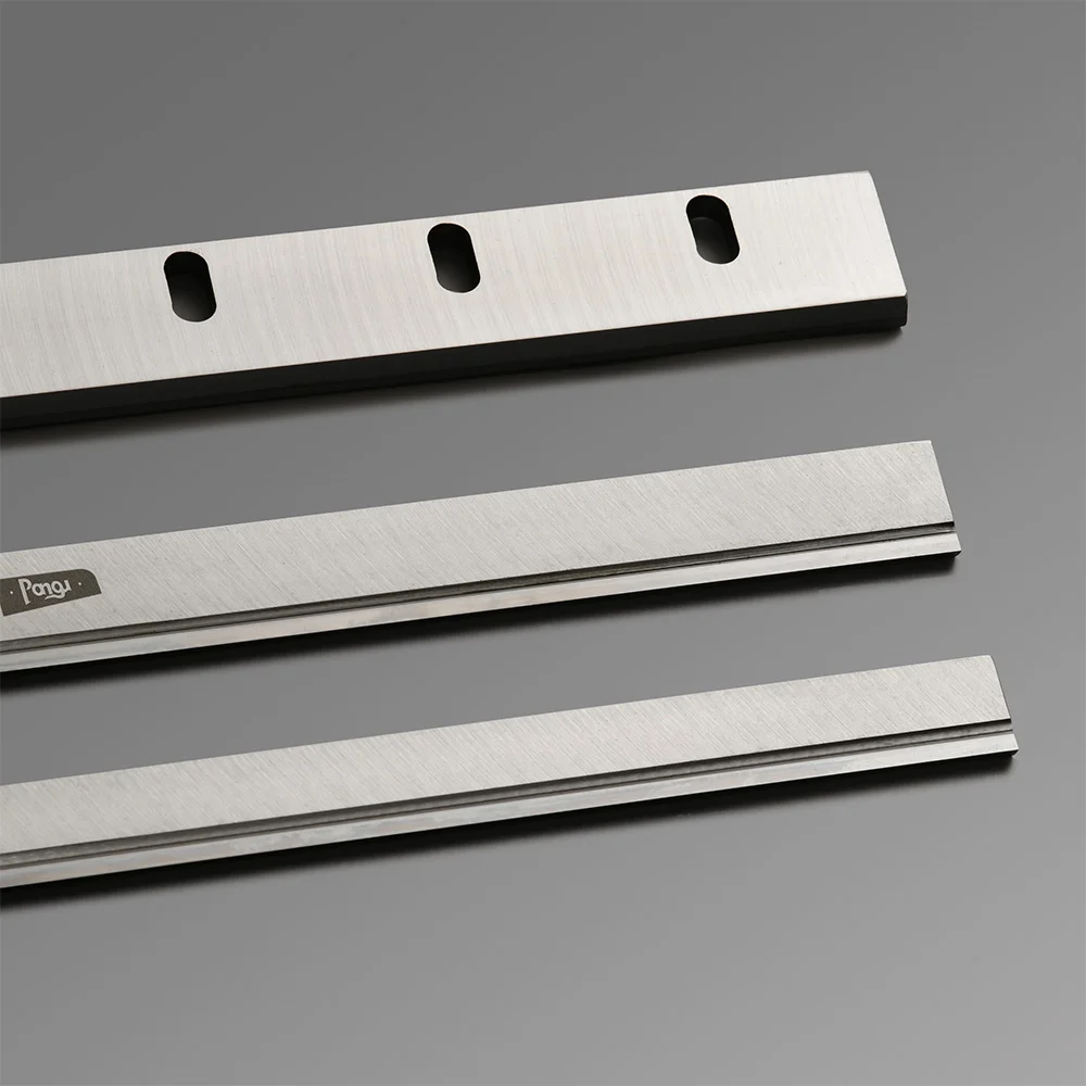 Cross cutting blade made of polished steel, designed with mounting hole for secure installation.